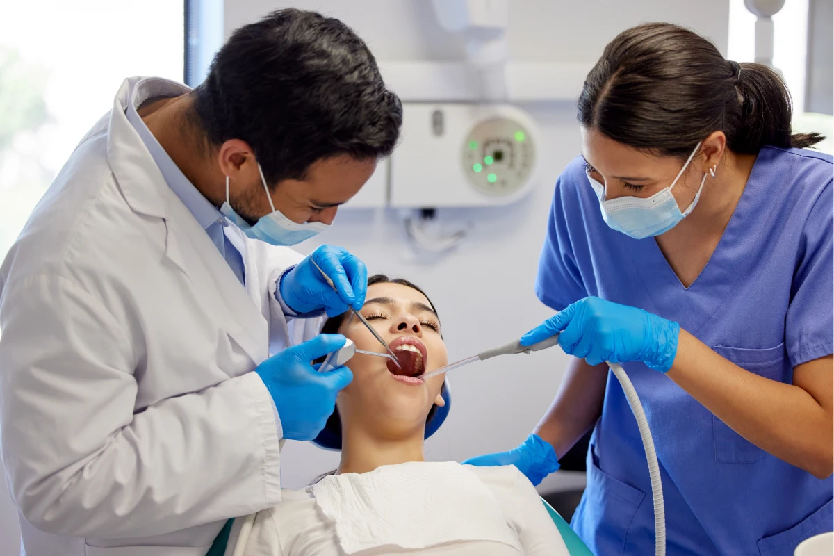 Dentist treating a patient with a dental filling to prevent further tooth decay at Solomon Family Dentistry