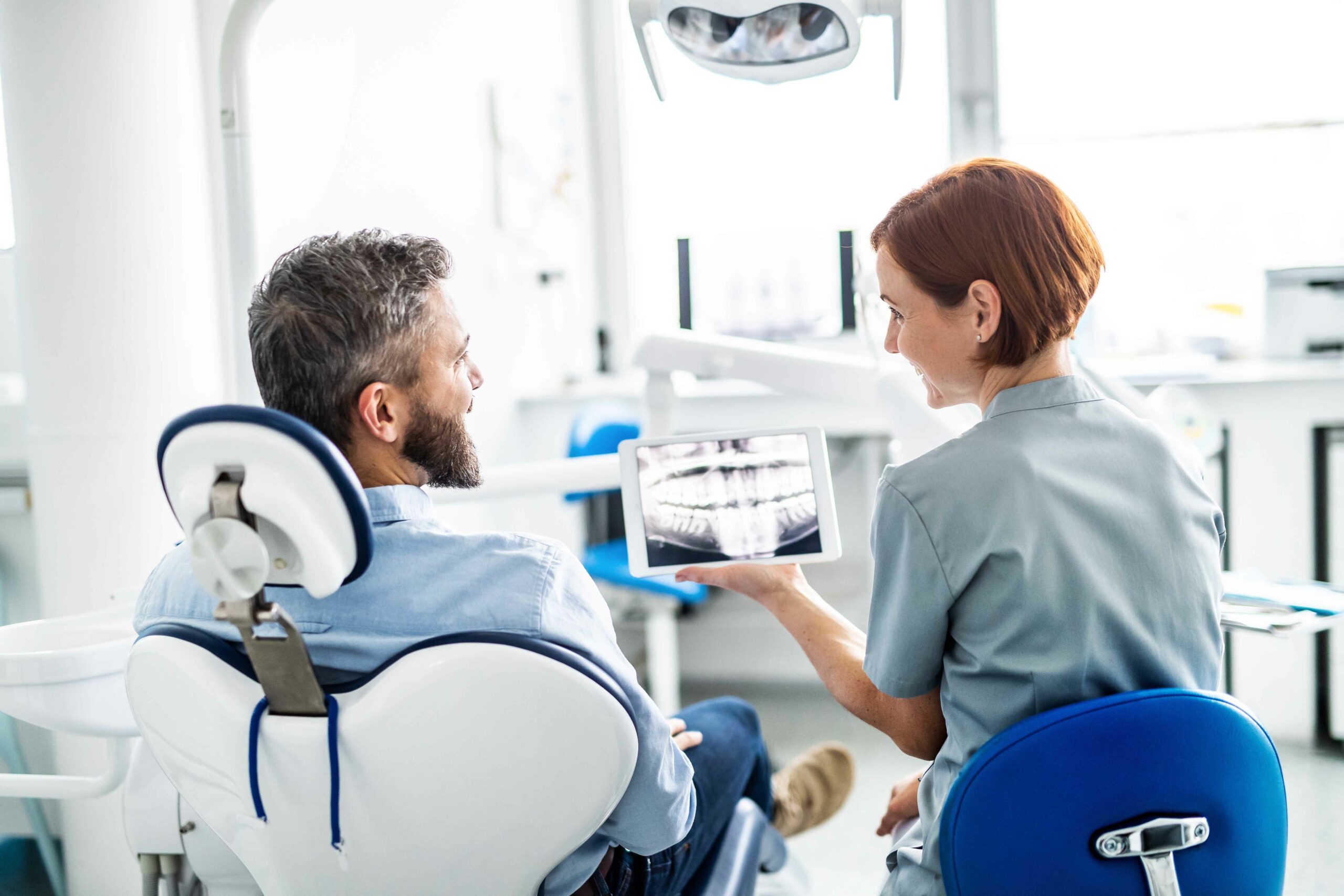 Dentist Explaining Dental X-ray to Patient | Solomon Family Dentistry in Summerville & Mount Pleasant, SC
