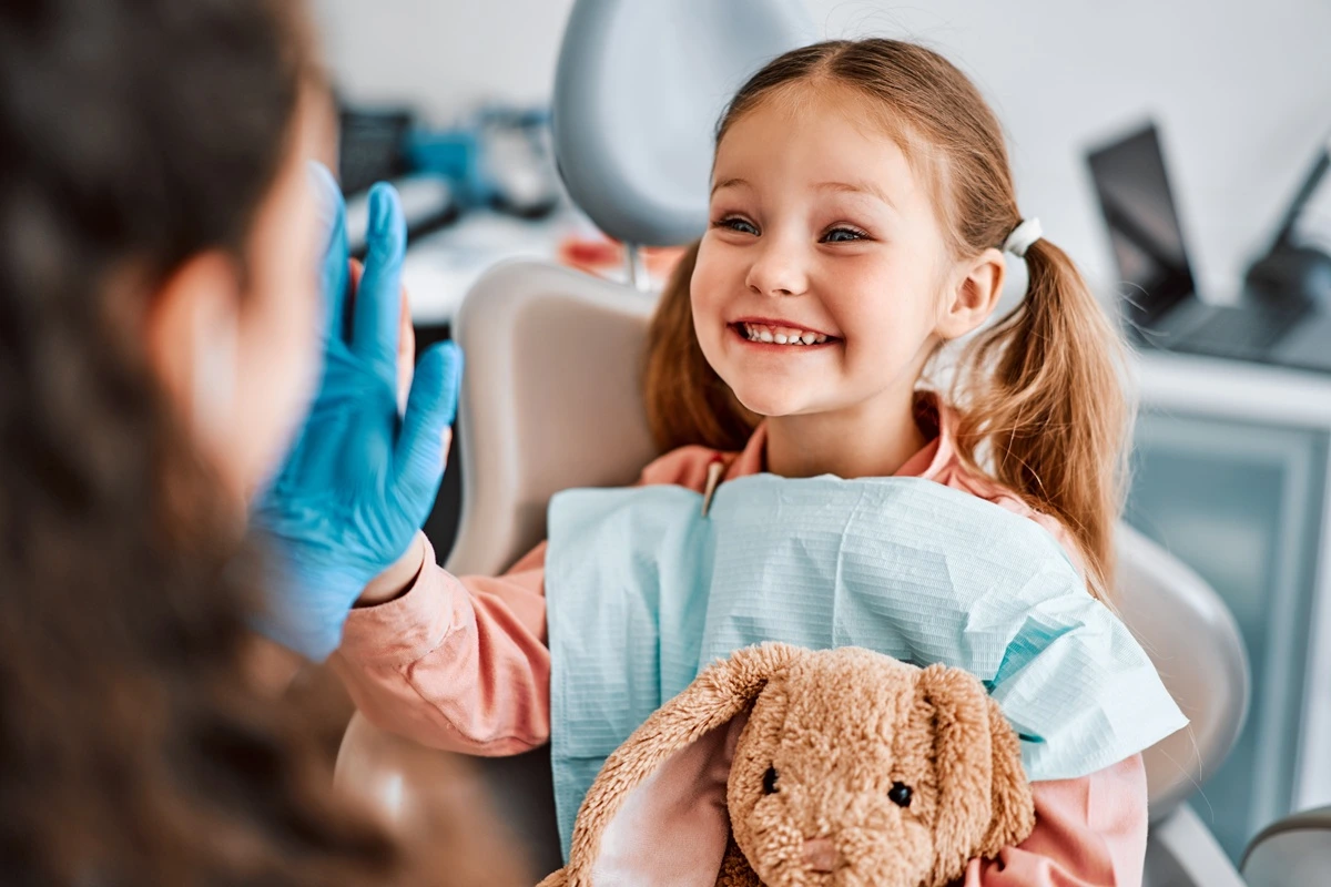 Smiling young child during a first dental check-up at Solomon Family Dentistry in Summerville & Mt. Pleasant, SC